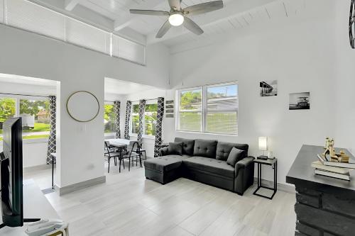 a living room with a couch and a table at Fort Lauderdale Home near Nightlife and Beach in Fort Lauderdale