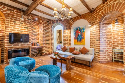 Μια τηλεόραση ή/και κέντρο ψυχαγωγίας στο Old Town Quito Suites, Heritage Hotel, Historic center