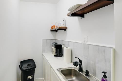 a kitchen with a sink and a counter top at Less Than 1 Mi to Dtwn Updated Studio in North Greenwood! in Greenwood