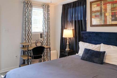 a bedroom with a bed and a desk and a window at Less Than 1 Mi to Dtwn Updated Studio in North Greenwood! in Greenwood