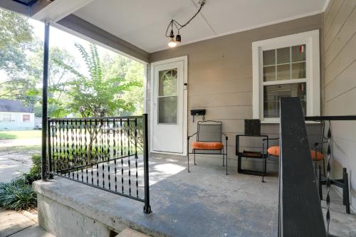 a porch of a house with chairs and a table at Less Than 1 Mi to Dtwn Updated Studio in North Greenwood! in Greenwood