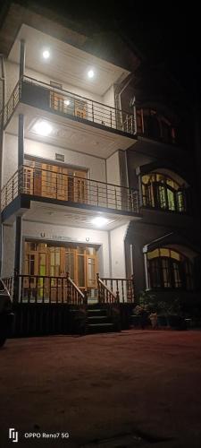 a large building with two floors and two balconies at Moonshine Homestay Kashmir in Srinagar