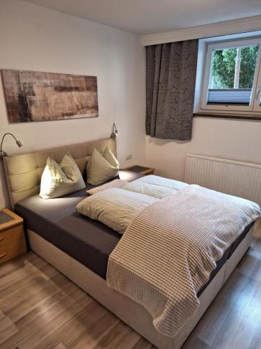 Postel nebo postele na pokoji v ubytování Haus Falkner Barbara