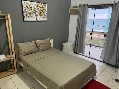 Ένα ή περισσότερα κρεβάτια σε δωμάτιο στο Pousada Maria Bonita