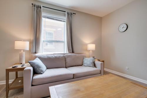 a living room with a couch and a window at Walk to WKU, Bars and Dining! Updated Duplex Home in Bowling Green