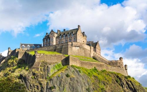 a castle on the top of a mountain at Hutchison apartments in Edinburgh