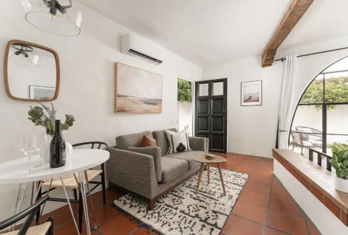 a living room with a couch and a table at Cozy New - Casa Blanca Suite B1 in Montecito