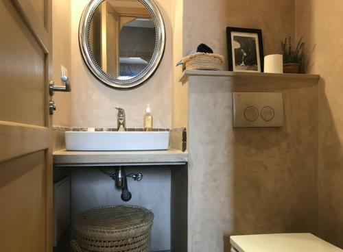a bathroom with a sink and a mirror at Waky Club - Fabulous Flat in Sraghna