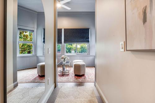 a hallway with a room with a table and two chairs at White House Napa in Napa