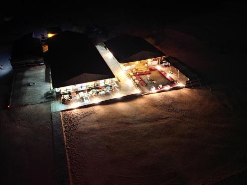 an overhead view of a building with lights at night at Rum Stars Camp in Wadi Rum