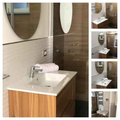 a bathroom with a sink and a mirror at La Maison de Claude in Palermo