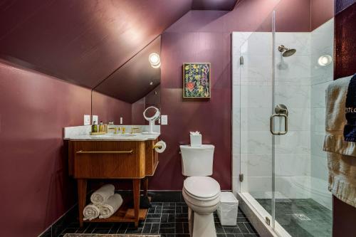 a purple bathroom with a toilet and a shower at White House Napa in Napa
