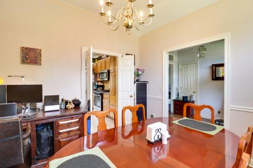 a dining room with a table and a kitchen at Spacious Suburban Home with Pool Access in Ridgeland in Ridgeland