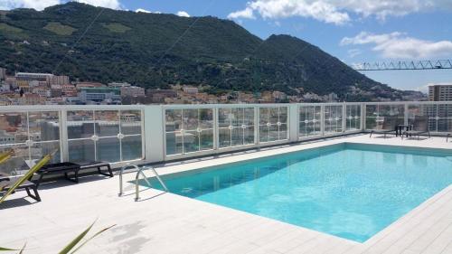 a swimming pool on the roof of a building at ET - Stylish Apartment In Centre With Pool in Gibraltar
