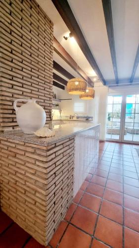 a kitchen with a large white bowl on a counter at Villa Blue beach Tabarca in Tabarca
