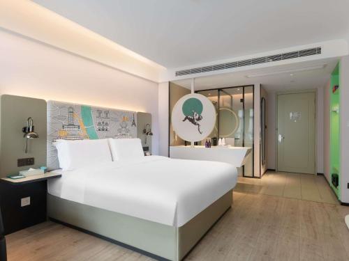 Ένα ή περισσότερα κρεβάτια σε δωμάτιο στο Mercure Chengdu Xindu