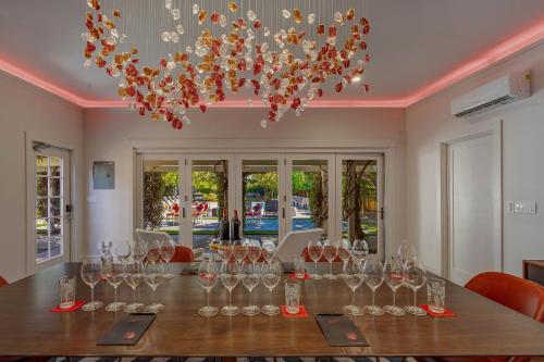 a dining room with a table with wine glasses at White House Napa in Napa