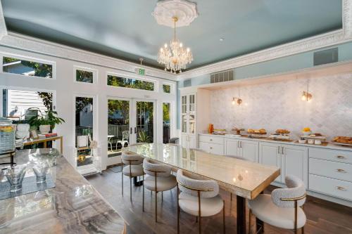 a kitchen with a large wooden table and chairs at White House Napa in Napa