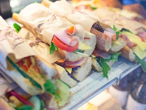 a bunch of sandwiches sitting on a shelf at Novotel Perth Murray Street in Perth