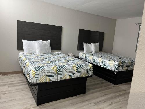 Cama o camas de una habitación en Suites West Memphis, AR - Memphis