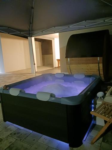 a large hot tub in a room with at Casa La Familia in Posušje