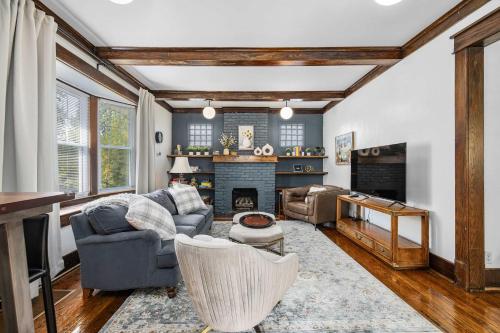 a living room with a couch and a fireplace at Family Friendly Home - Fenced yard - Parking in Fort Wayne