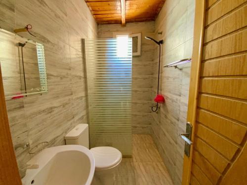 a bathroom with a sink and a toilet and a shower at The View Nile Villa in Jazīrat al ‘Awwāmīyah