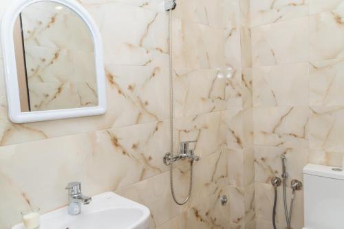 a bathroom with a shower and a sink at Tifawine Stay Guest House Social Stay and Oceanview Rooms in Imsouane