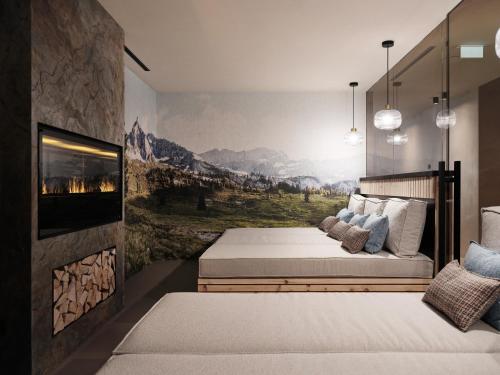a bedroom with a bed and a wall with a fireplace at Hotel Garni Pinzgau, Fabian Hüttl in Neukirchen am Großvenediger