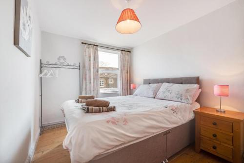 a bedroom with a large bed and a window at Woodcocks in Docking