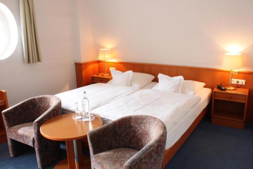 Ένα ή περισσότερα κρεβάτια σε δωμάτιο στο Hotel Kloppenborg