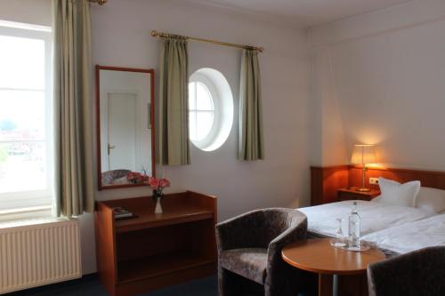 Ένα ή περισσότερα κρεβάτια σε δωμάτιο στο Hotel Kloppenborg