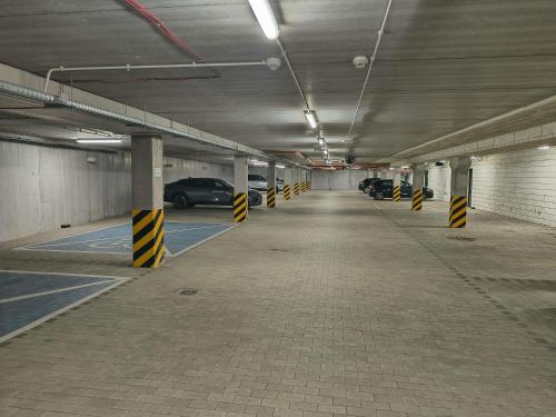 an empty parking garage with cars parked in it at ibis styles Bolesławiec in Bolesławiec