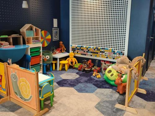 a room filled with lots of different types of toys at ibis styles Bolesławiec in Bolesławiec
