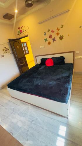 a bedroom with a bed in a room with stars on the wall at HOTEL ROOMS new MP GUEST INN in Nellore