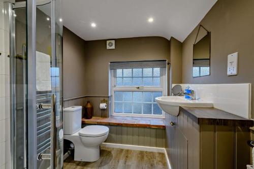 Vannituba majutusasutuses Cobblers Cottage - Holt