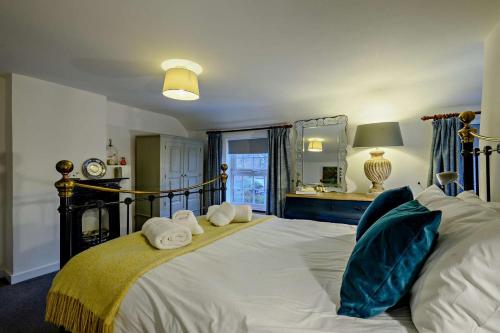 Voodi või voodid majutusasutuse Cobblers Cottage - Holt toas