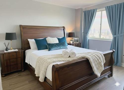 a bedroom with a large bed with two towels on it at Limited Time Offer Downtown Stay Parking in Atlanta