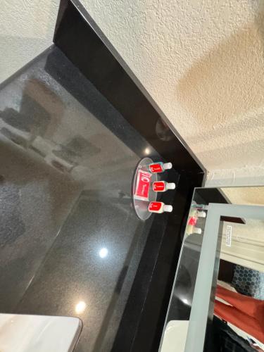 a kitchen with a fire extinguisher on the ceiling at Edyn Hotel By Townhouse Wytheville US 52 in Wytheville