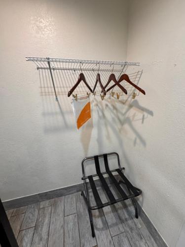 a towel rack with hangers on a wall at Edyn Hotel By Townhouse Wytheville US 52 in Wytheville