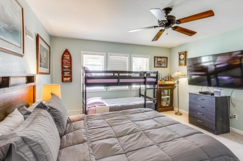 a bedroom with two bunk beds and a ceiling fan at Port Clinton Home with Private Dock and Gazebo! in Port Clinton