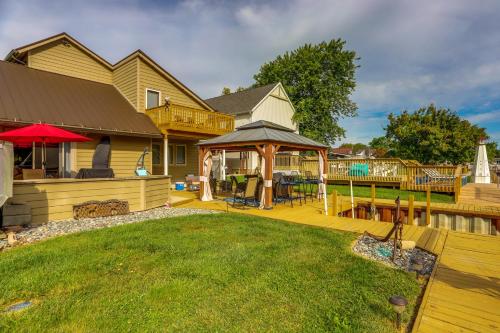 a backyard with a deck and a gazebo at Port Clinton Home with Private Dock and Gazebo! in Port Clinton