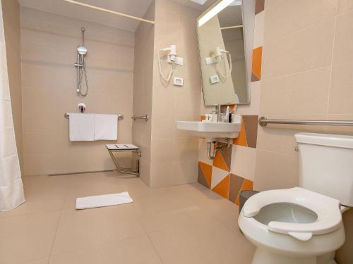 a bathroom with a toilet and a sink at ibis Styles Lima Benavides Miraflores in Lima