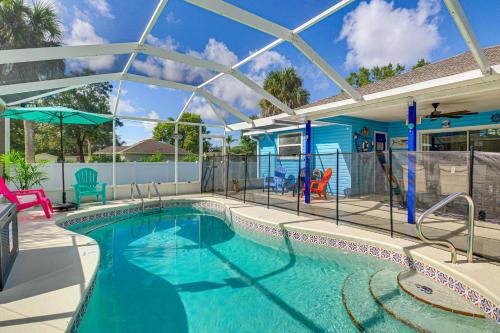 a large swimming pool with a pool at Fenced Yard, Game Room Family Home in Sebastian! in Sebastian