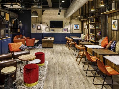 a restaurant with tables and chairs in a room at ibis Budget Sheffield Centre St Marys Gate in Sheffield