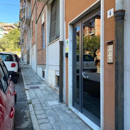 an alley with cars parked on the side of a building at marsa in Chiappa
