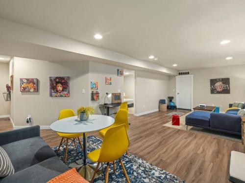 a living room with a couch and a table and chairs at The Meadow in Tacoma