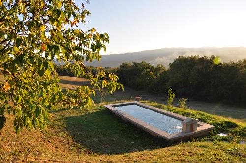 The swimming pool at or close to B&B La Collina