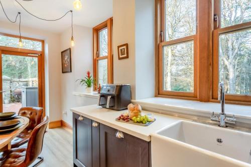 a kitchen with a sink and a counter at Gardeners Cottage at Craighead in Huntly