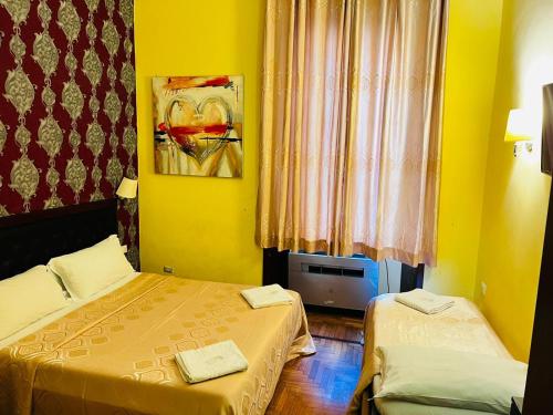 Katil atau katil-katil dalam bilik di Rome central station guest house